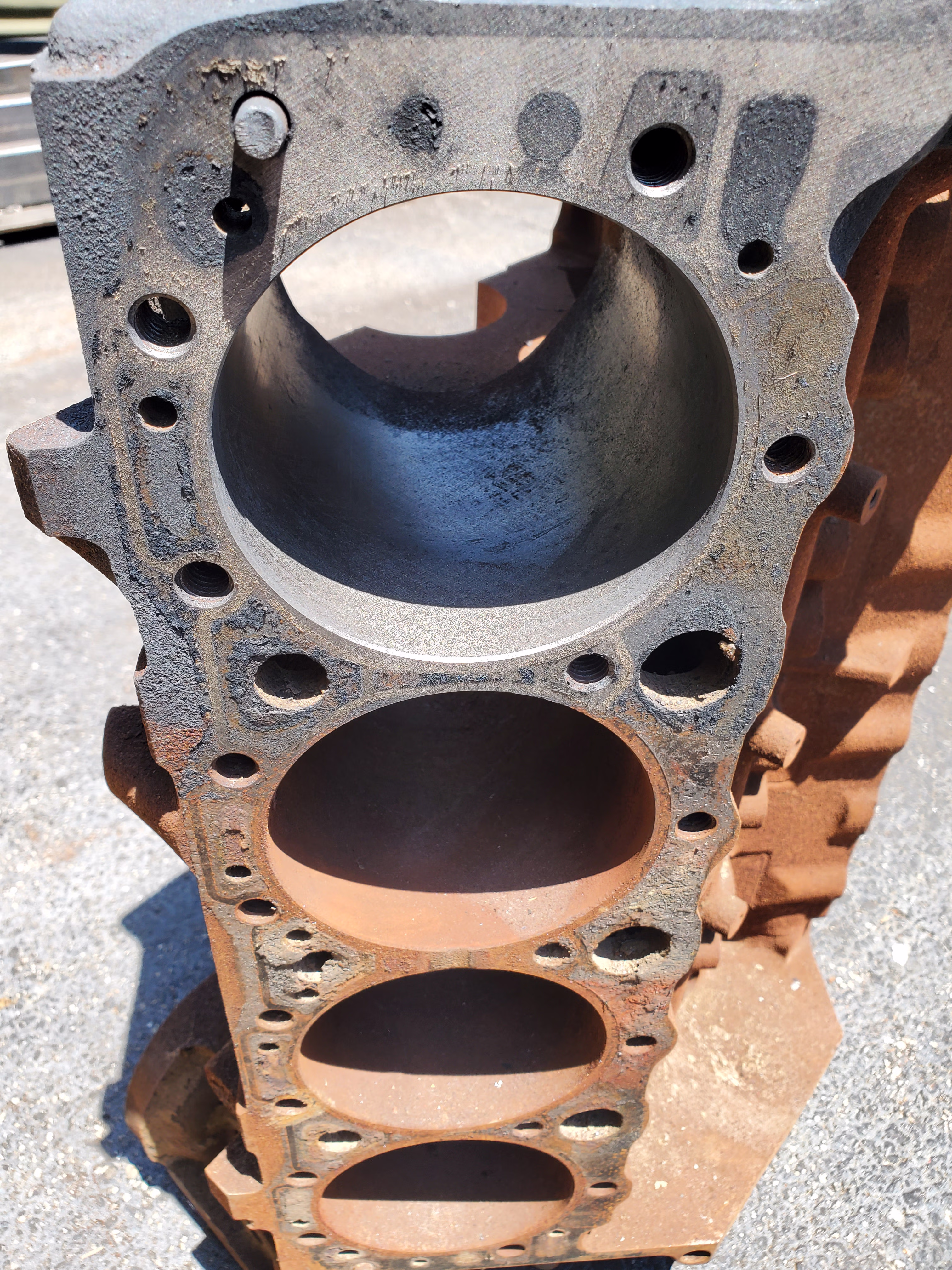 Non contact laser rust removal on engine block.