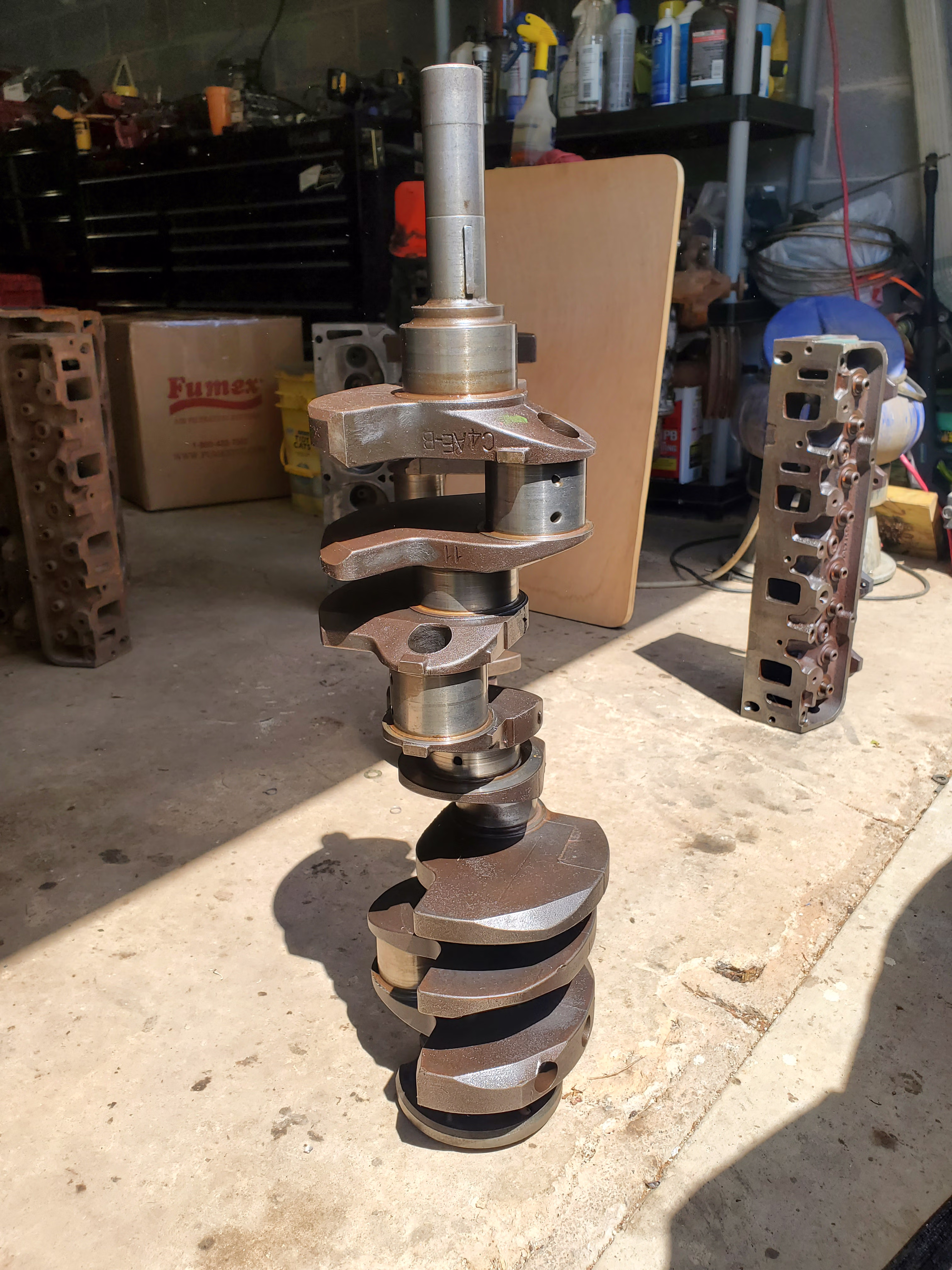 Engine crank cleaned with vibratory rust removal solution.